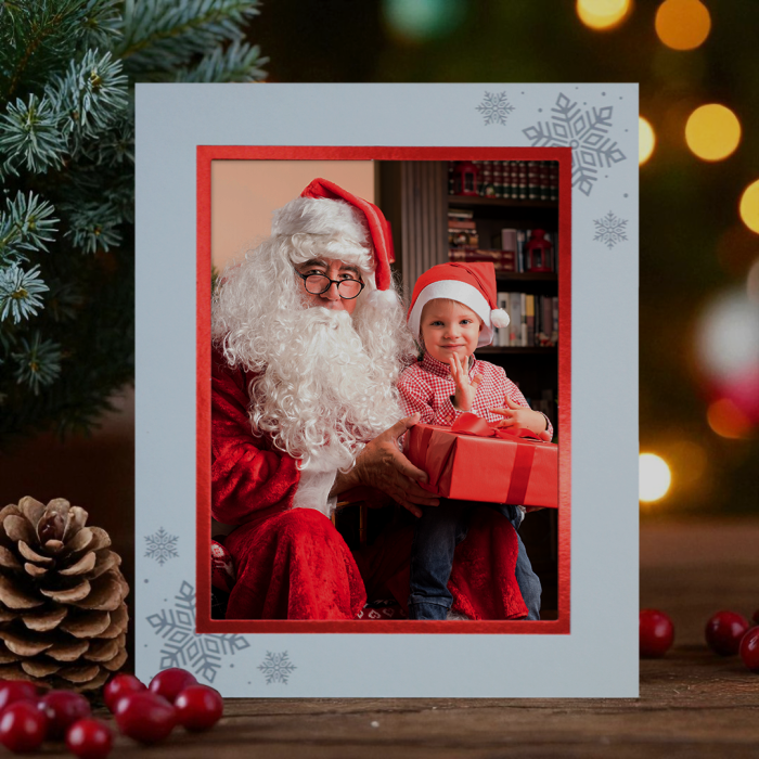 Christmas photo displayed in a festive cardboard strut mount